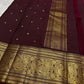 Rich burgundy red pure Kanjivaram saree with traditional zari border and pallu
