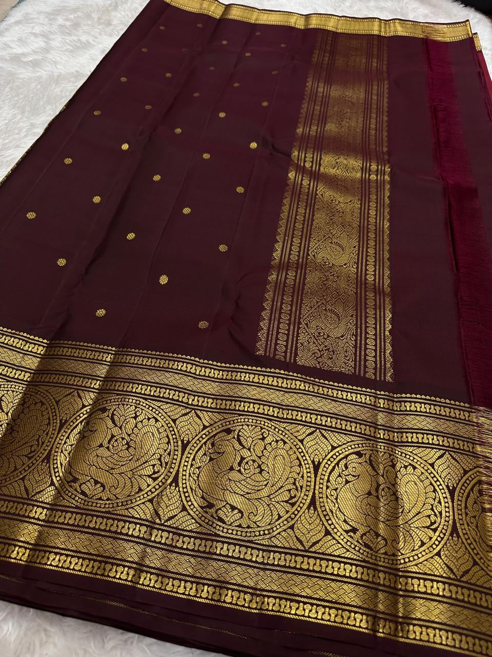 Rich burgundy red pure Kanjivaram saree with traditional zari border and pallu