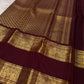 Close border view with large handwoven Yazhi motifs framed by multiple fine gold zari registers