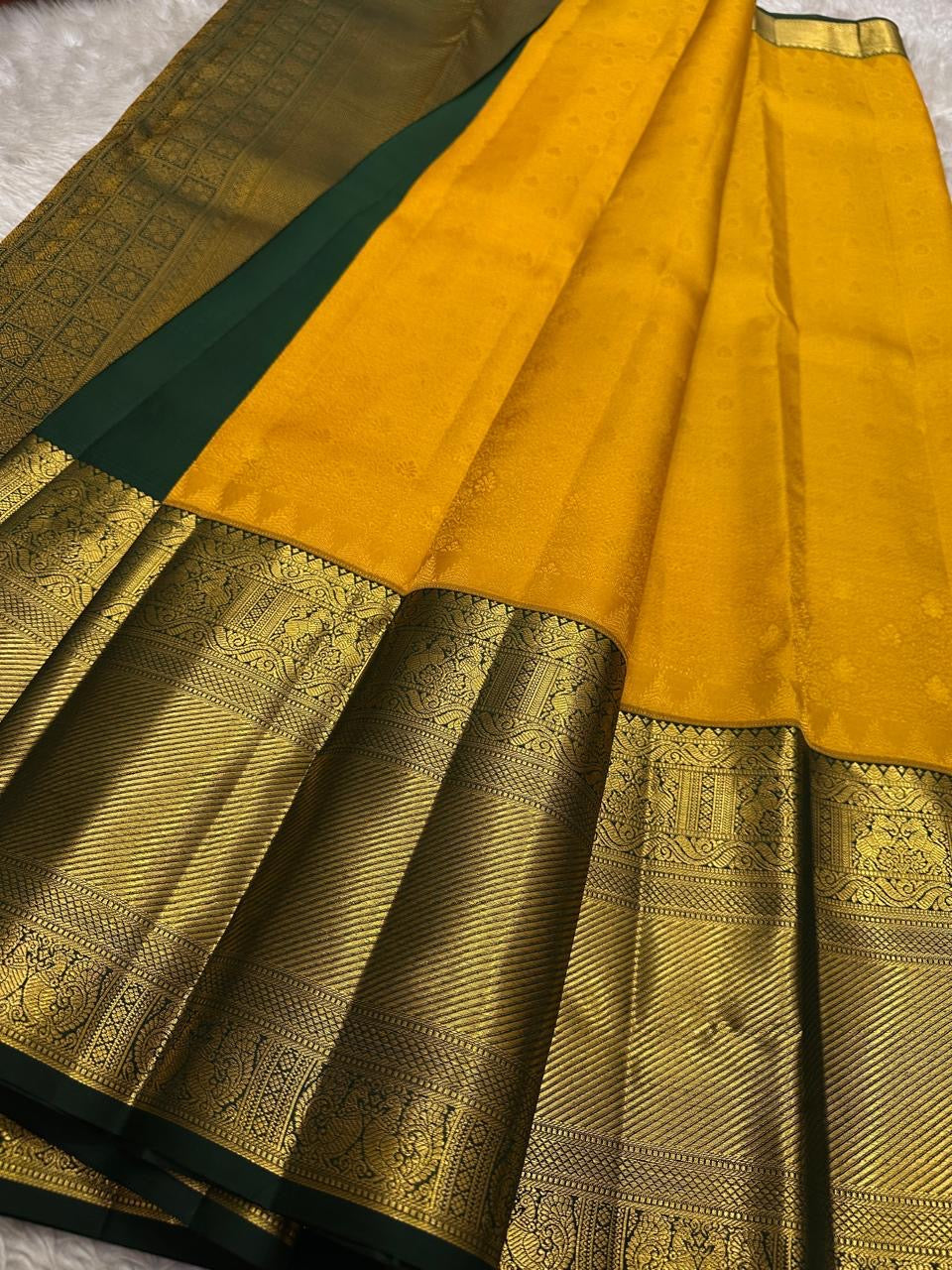 Wide view of mustard yellow Pure Kanchipuram silk saree with dark green zari woven border, shipped from New Jersey USA.