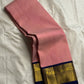 Rose pink Kanchipuram silk saree drape view showing fine self-striped texture and navy zari woven border