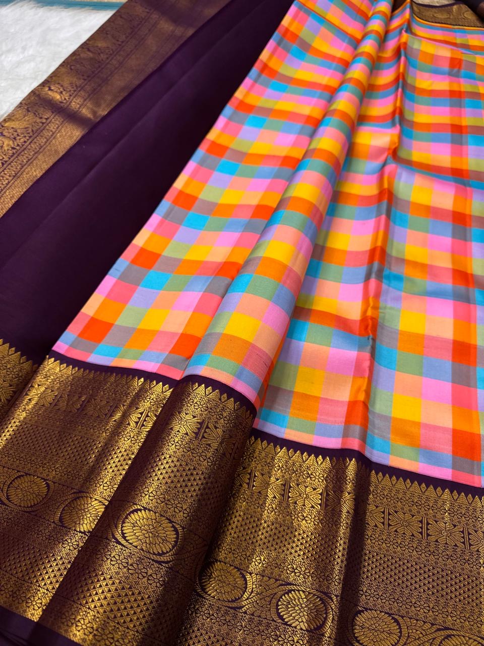 Deep aubergine contrast border with densely woven gold florals | Kanjipuram pure silk saree.