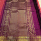 Close-up of chedi butta in gold zari on rose orange double shade Kanchipuram silk saree — Idam Living