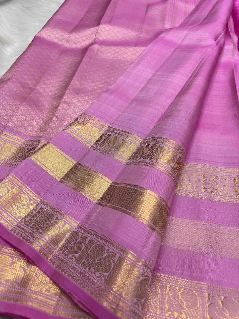 Rose Orchid Pink Pure Silk Kanchipuram Varisaipet saree with gold zari border and woven pallu.