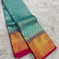 Rose peach handwoven Kancheepuram Zari Kattam saree with royal blue border, full drape view.