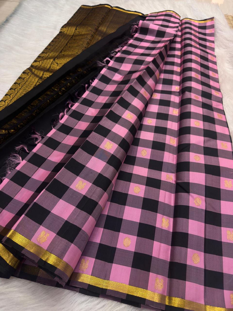 Handwoven pink and black Kanchipuram silk saree with precision checker pattern