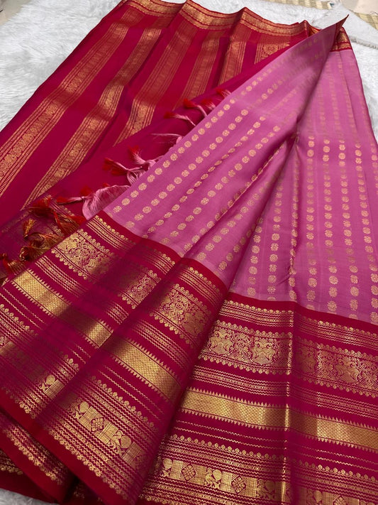 Rose pink Kancheepuram silk body close-up showing petite mayil chakram butta motifs