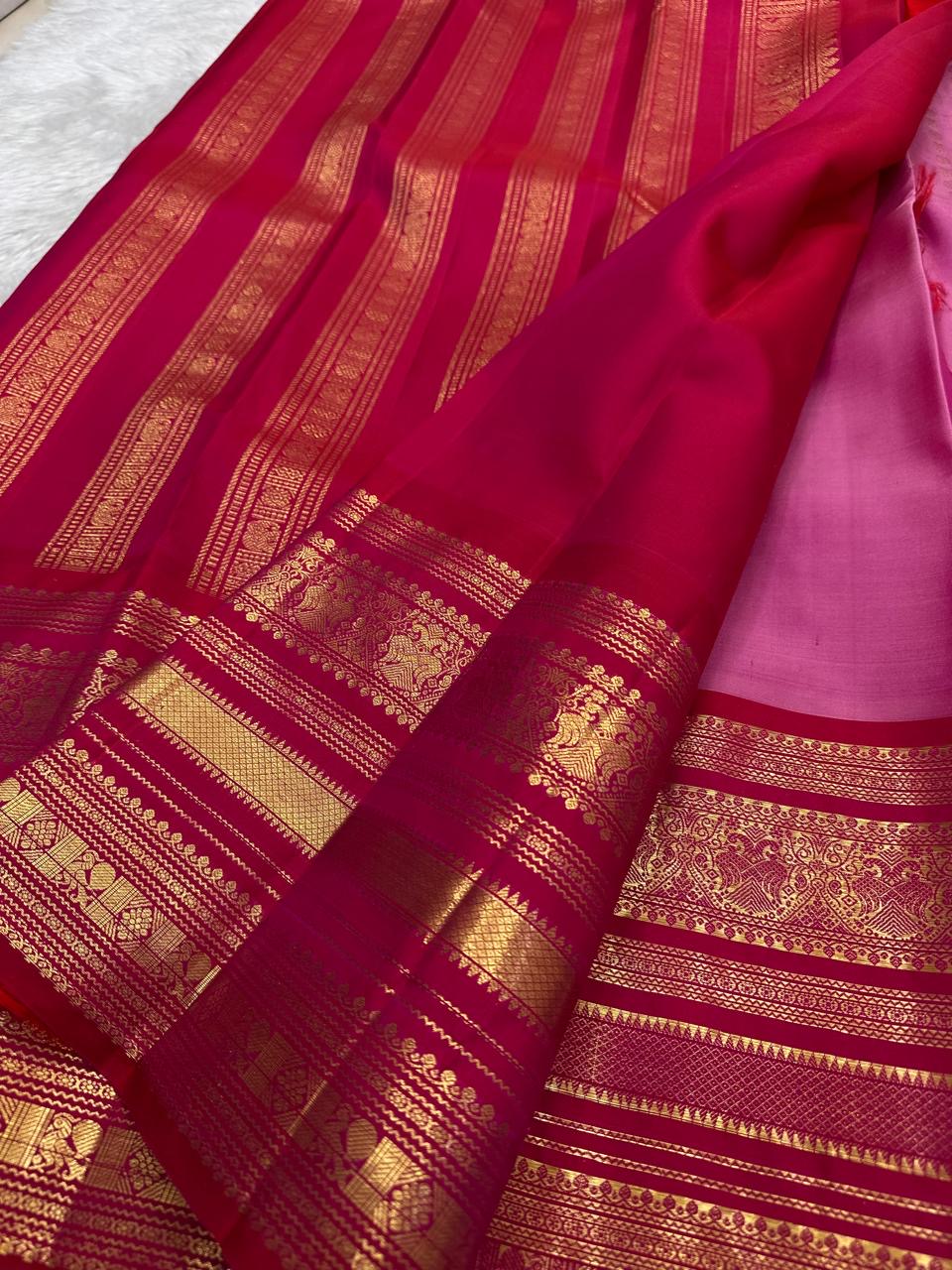 Deep rani pink varisaipet border detail on Kancheepuram silk saree