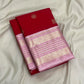 Handwoven crimson silk body showing regularly spaced circular zari medallions and stylised bird motifs.