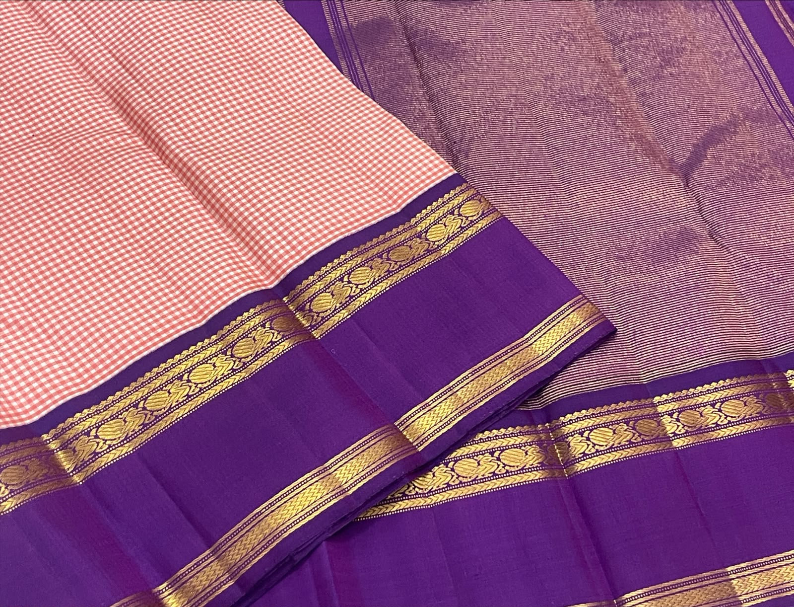 Rose pink Kanchi Pattu saree with Kanchi Kattam checks and royal purple zari border.