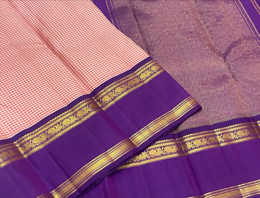 Rose pink Kanchi Pattu saree with Kanchi Kattam checks and royal purple zari border.