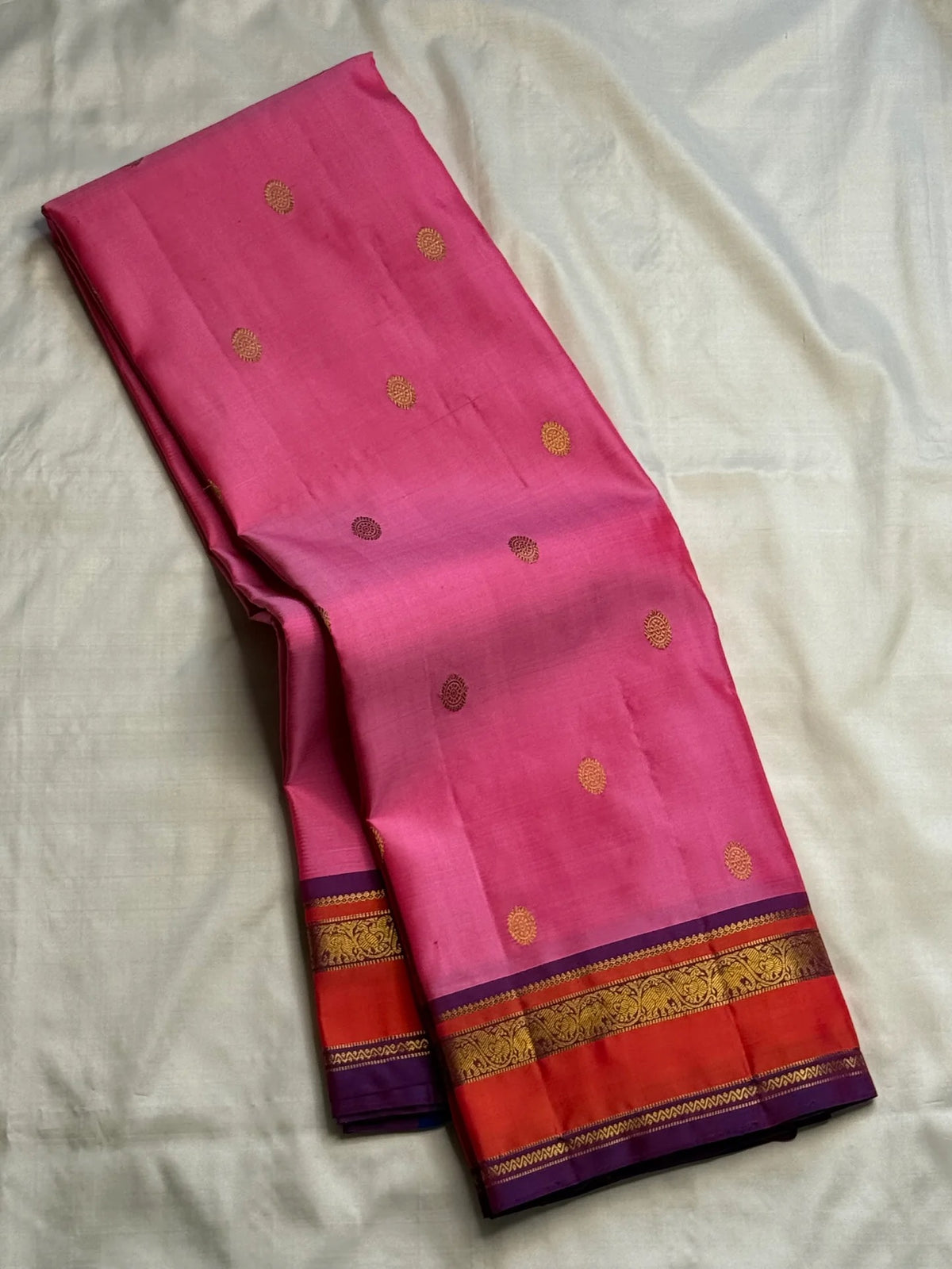 Rose pink handwoven Pure Silk Kanchipuram Butta saree with coral-orange and purple border