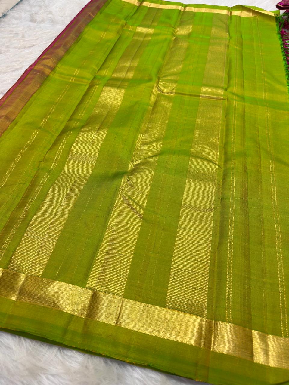 Rose pink Kanjeevaram silk saree with lime green accents, blouse piece