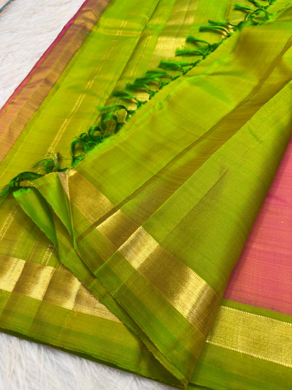 Rose pink Kanjeevaram silk saree with lime green and gold zari pallu
