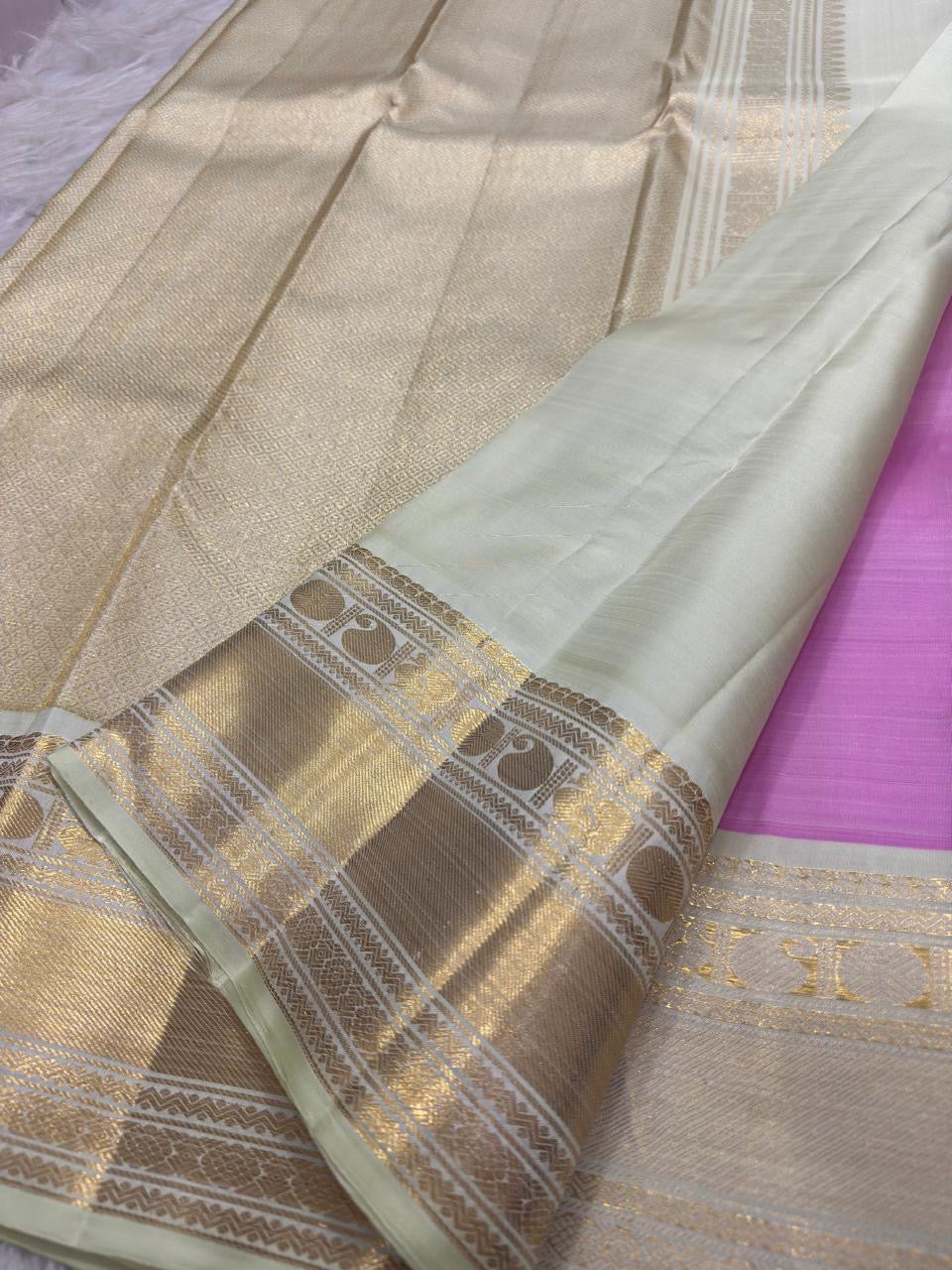 Warm Ivory gold zari traditional bird border on Rose Pink Kanchipuram saree