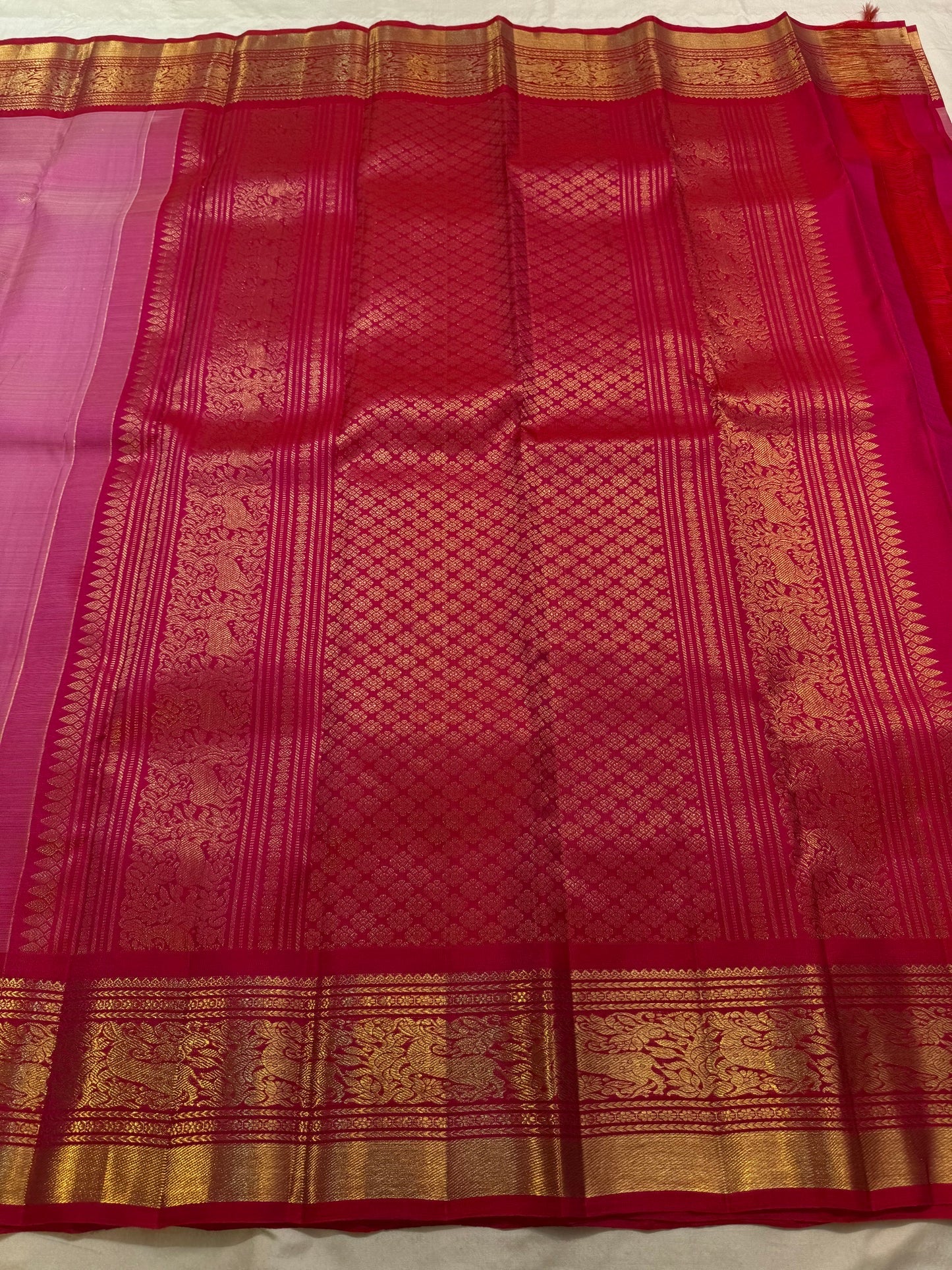Raspberry-red Vanasringaram zari border on rose pink Kanjeevaram Korvai saree