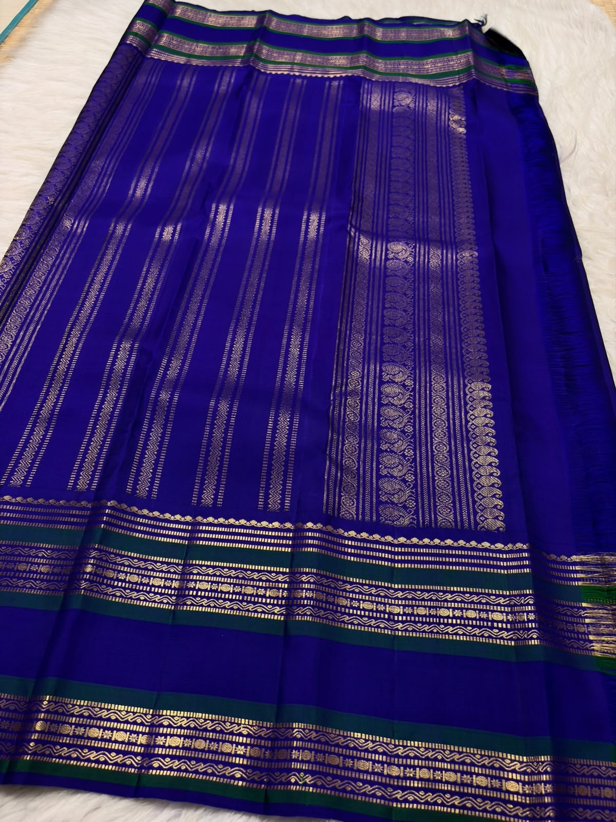 Radiant Neelam Blue Handwoven Pure Silk Kanchipuram Varisaipet Saree with Zari Mayil Chakram Buttas