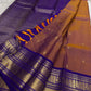 Rosewood copper Kanjeevaram silk saree with traditional gold zari close-up