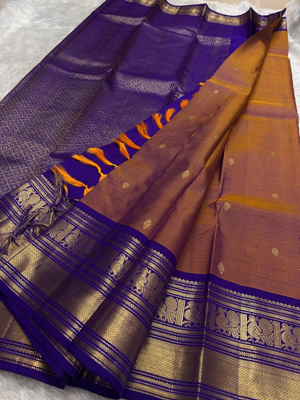 Rosewood copper Kanjeevaram silk saree with traditional gold zari close-up