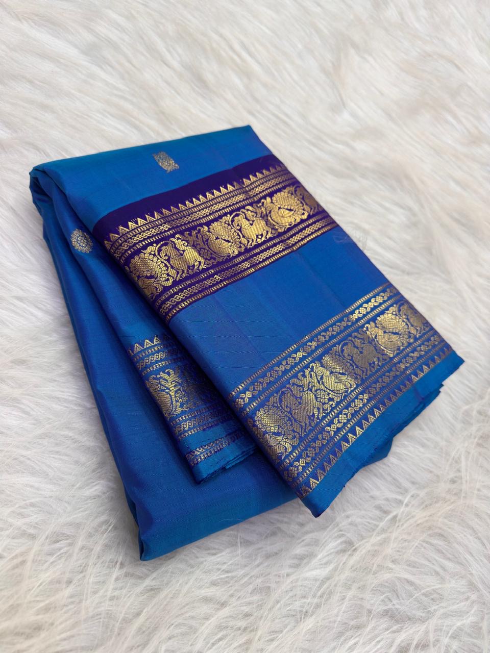 Royal azure blue Rettapet Kanjivaram saree with silver zari buttas, full view