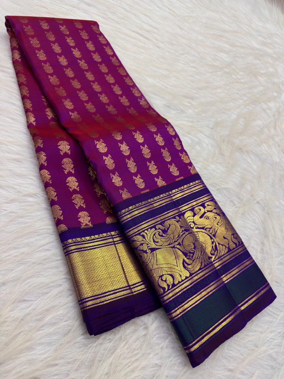 Detail of the royal blue border on the Vadamalli magenta Kanchipuram Butta saree