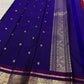 Pallu with woven gold zari on royal blue and deep cherry red Kanchipuram silk saree