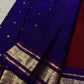Deep cherry red and royal blue Pure Silk Kanchipuram saree with burgundy undertones and gold zari