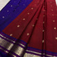 Deep cherry red handwoven Pure Silk Kanchipuram saree with royal blue contrast, mayil buttas and zari border