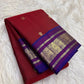 Royal blue contrast border with ornamental zari on cherry red Pure Silk Kanchipuram saree