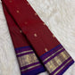 Petite handwoven mayil buttas in gold zari on deep cherry red Kanchipuram silk