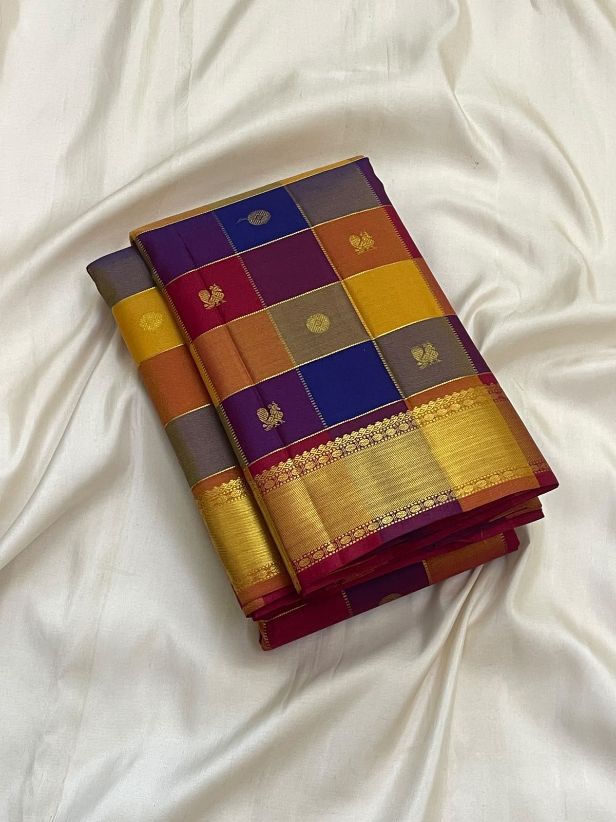 Multicolour Kanchipuram Paalum Pazhamum border with broad antique-gold zari and raspberry framing.