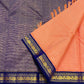 Royal blue floral vine border detail on the soft peach ivory Kanchipuram saree