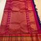 Full Royal Blue Kanchipuram Korvai saree with gold body motifs and richly stacked Rani Pink zari border.