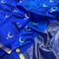 Close-up of gold zari buttas and striped border on royal blue Chanderi silk saree