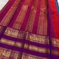 Magenta pallu with gold zari elephant and peacock motifs on royal blue Kancheepuram Varisaipet saree