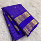 Ornate self-colour border of royal blue Kancheepuram saree with dense Kamalam and Mayil antique gold zari array