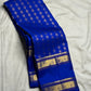 Close view of antique gold floral buttas on Royal Blue Kanjivaram silk