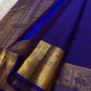 Royal blue Pure Silk Kanjivaram with multi-layer Kamalam buttas and broad gold zari peacock border.