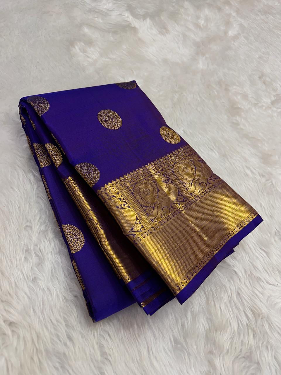 Neelam blue Pure Silk Kanchipuram body with elaborate circular Kamalam buttas.