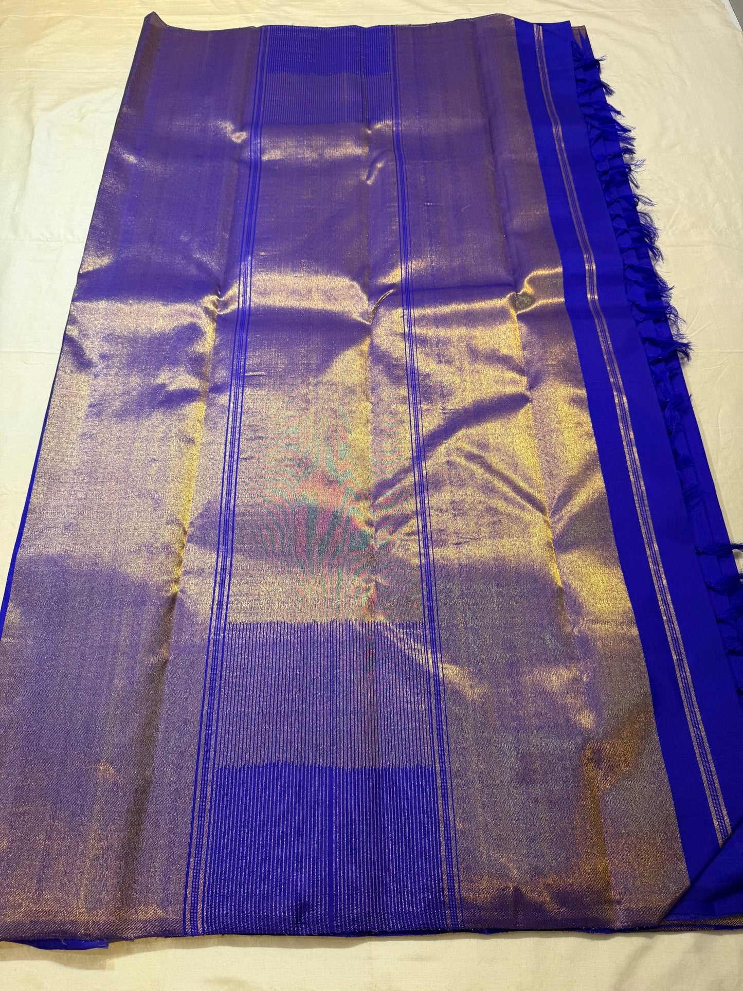 Close-up of ettukol antique copper zari border on royal blue Kanchipuram pure silk saree — Idam Living