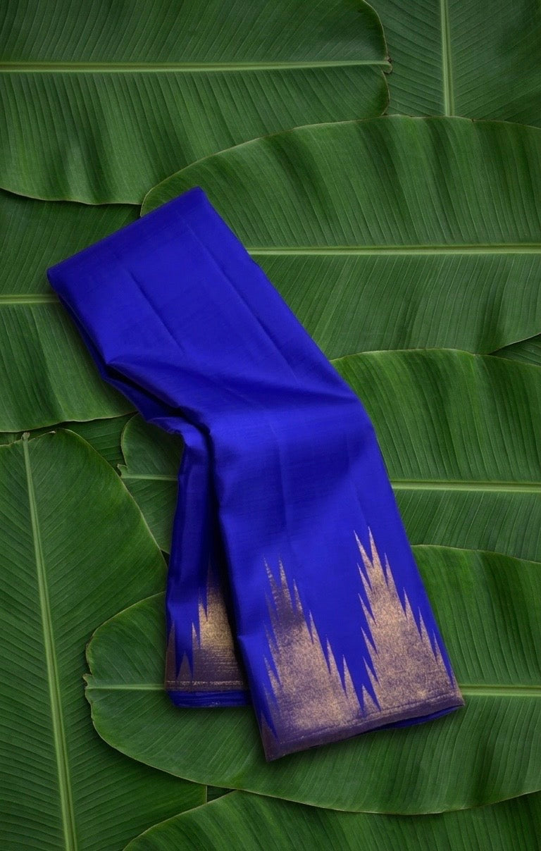 Royal blue handwoven Kancheepuram pure silk saree with ettukol antique copper zari border on banana leaf — Idam Living