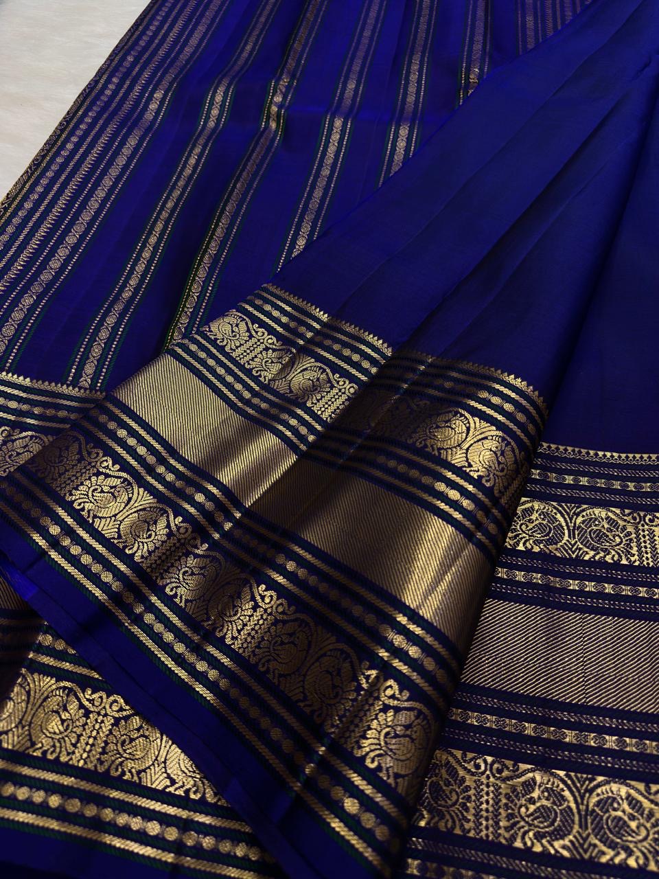 Royal Blue Kanchipuram Saree — Varisaipet border with gold zari peacock motifs and alternating bands