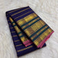 Royal blue Kanchipuram silk showing Veldhari zari bands across the body.