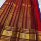Broad traditional red border framing a royal blue silk saree