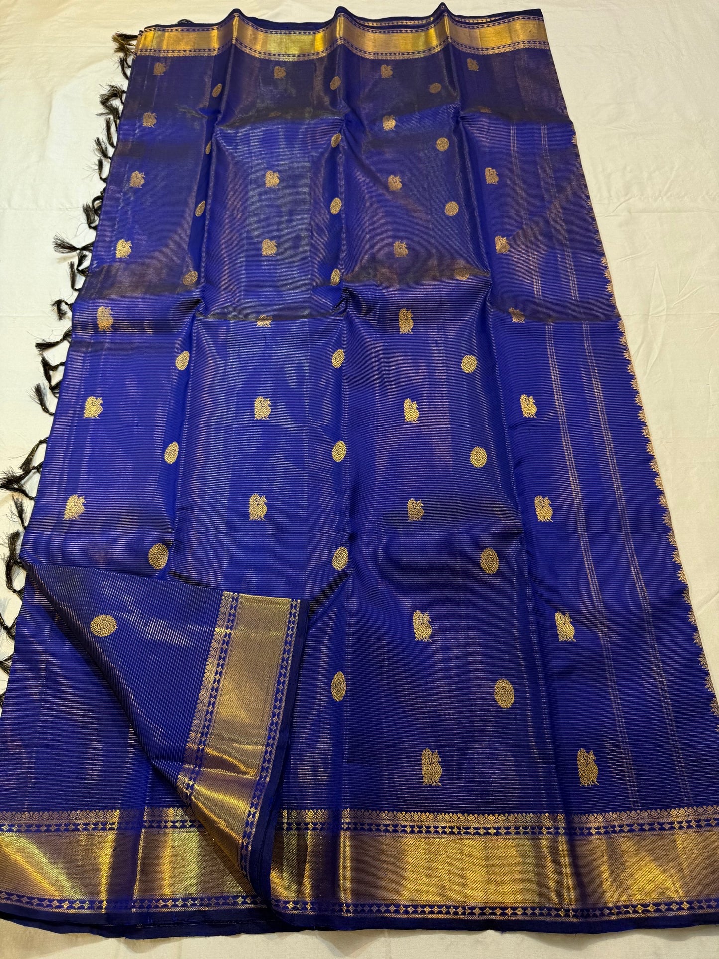 Close-up of kamalam butta in gold zari on royal blue Kanjipuram silk saree — Idam Living