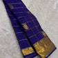 Close-up of gandaberunda double-headed bird butta in gold zari on royal blue Kanjivaram silk saree — Idam Living