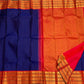 Handwoven royal-blue Pure Silk Kanchipuram Varisaipet saree with a warm burnt-orange zari border.