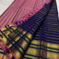 Royal blue Kanjivaram Varisaipet saree showing the deep-green border and pink-purple pallu.