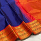 Saturated Neelam-blue Kanchipuram silk body with a plain open field and strong contrast border.