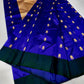 Gold floral butta motif close-up on royal blue Chanderi silk saree